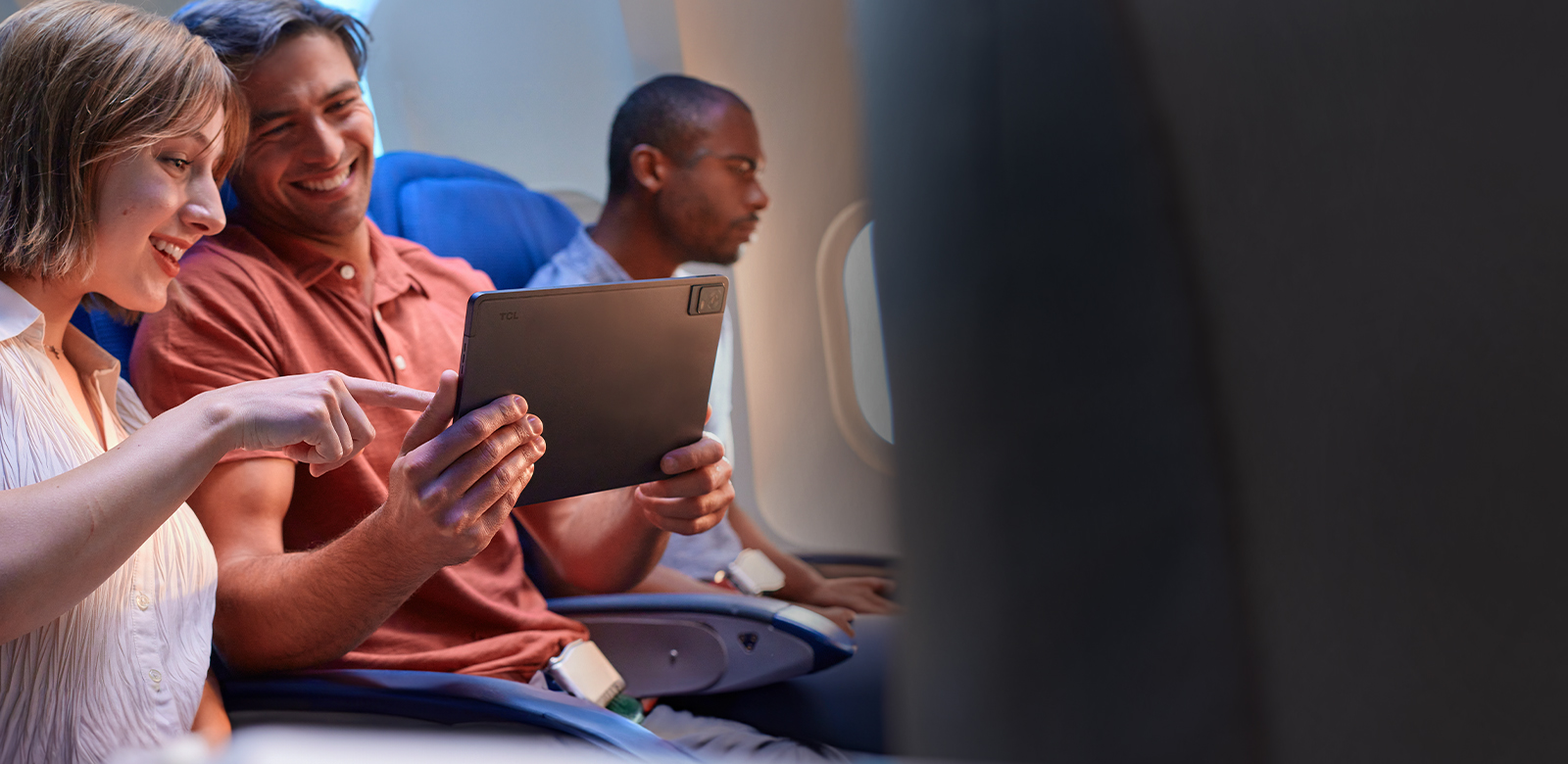 couple watching movie on plane