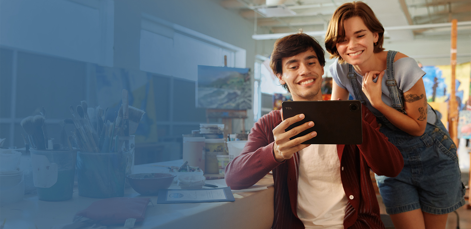 couple streaming on tablet with all day battery